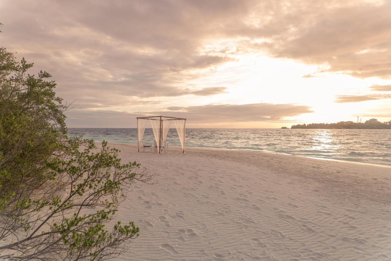 Malahini Kuda Bandos Resort Hulhumale Exterior photo Sunset at the beach