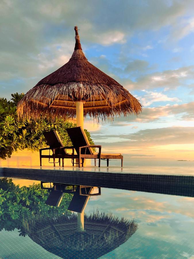 Malahini Kuda Bandos Resort Hulhumale Exterior photo Sunset at the beach
