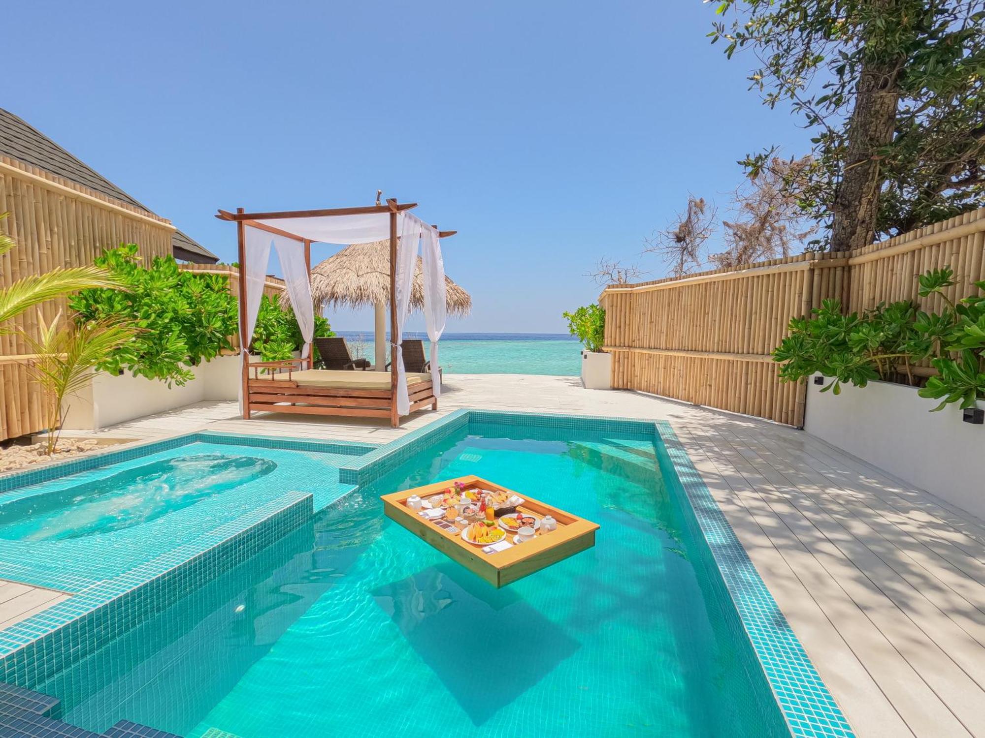 Malahini Kuda Bandos Resort Hulhumale Exterior photo A pool at a resort in Maldives